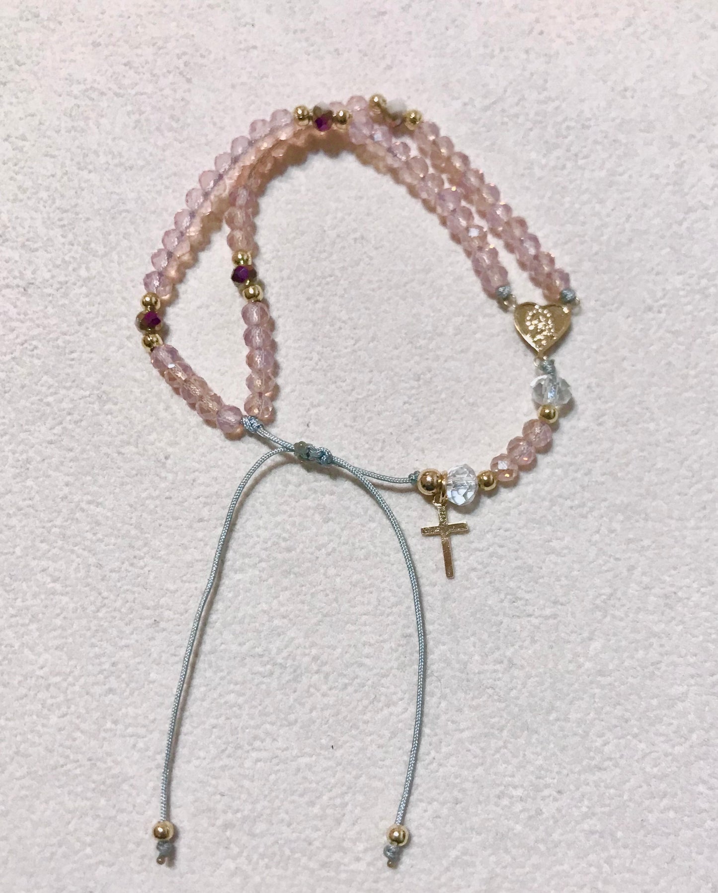 Pulsera Rosario rosada.